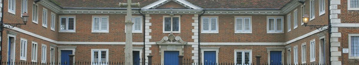 Brick courtyard building with railings, used on the enquiries page.